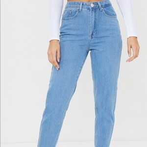 Must have mom jeans features a light wash.